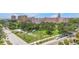 Charming street view showcases lush greenery, tropical palms and views of the Don CeSar Hotel at 700 Beach Ne Dr # 602, St Petersburg, FL 33701