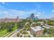 Street view shows tropical trees, colorful architecture, and vibrant city skyline in the background at 700 Beach Ne Dr # 602, St Petersburg, FL 33701