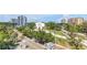 Inviting view from the condo featuring mature trees, neighboring buildings, and local streetscape at 700 Beach Ne Dr # 602, St Petersburg, FL 33701