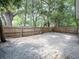 Large fenced-in backyard with mature trees and foliage at 708 E Patterson St, Tampa, FL 33604