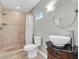 Bathroom featuring a stand-up shower, stylish vanity, and tiled floors at 708 E Patterson St, Tampa, FL 33604