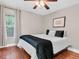Bedroom featuring hardwood floors, a ceiling fan, and natural lighting at 708 E Patterson St, Tampa, FL 33604