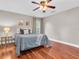 Well-lit bedroom with hardwood floors, a ceiling fan, and calming decor for a serene retreat at 708 E Patterson St, Tampa, FL 33604
