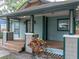 Close-up of a cozy bungalow featuring a covered porch and quaint architectural details at 708 E Patterson St, Tampa, FL 33604