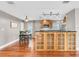 Bright kitchen and dining area with wood floors and cabinetry plus stainless appliances at 708 E Patterson St, Tampa, FL 33604