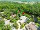 Beautiful aerial view of home and river featuring lush landscaping and mature trees at 713 Argyle Pl, Temple Terrace, FL 33617