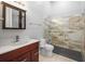 Bathroom featuring modern vanity, glass-enclosed shower with decorative tile, and tile flooring at 713 Argyle Pl, Temple Terrace, FL 33617