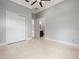 Spacious bedroom with tile floors, closet, and access to the bathroom at 713 Argyle Pl, Temple Terrace, FL 33617