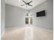 Bedroom with tile flooring, arched windows, recessed lighting, and a ceiling fan at 713 Argyle Pl, Temple Terrace, FL 33617