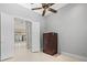 Bedroom featuring a window, tile flooring, and neutral color palette at 713 Argyle Pl, Temple Terrace, FL 33617