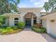Inviting front entry showcasing a well-manicured lawn and elegant front door at 713 Argyle Pl, Temple Terrace, FL 33617