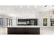 Gourmet kitchen featuring modern appliances, custom cabinets, and spacious island at 713 Argyle Pl, Temple Terrace, FL 33617