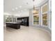 A kitchen showcases dark wood cabinets, stainless steel appliances, and large windows at 713 Argyle Pl, Temple Terrace, FL 33617