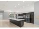 Bright kitchen features modern stainless steel appliances, dark wood cabinetry, and a large center island at 713 Argyle Pl, Temple Terrace, FL 33617