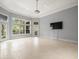Spacious living room featuring tile floors, recessed lighting, and multiple windows with natural light at 713 Argyle Pl, Temple Terrace, FL 33617