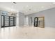Light-filled living room showcasing tile flooring, and contemporary entryway at 713 Argyle Pl, Temple Terrace, FL 33617