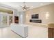 Bright living room with a modern fireplace and tile flooring throughout the space at 713 Argyle Pl, Temple Terrace, FL 33617