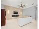 Bright living room with a modern fireplace and tile flooring throughout the space at 713 Argyle Pl, Temple Terrace, FL 33617