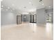 Spacious living room showcasing neutral walls, tile flooring, and a modern entrance at 713 Argyle Pl, Temple Terrace, FL 33617