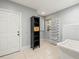 Functional mud room with storage shelves, utility sink, and convenient outdoor access at 713 Argyle Pl, Temple Terrace, FL 33617