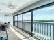 Enclosed balcony features tile flooring, a ceiling fan, and sliding glass doors with water views at 809 Bahia Del Sol Dr # 72, Ruskin, FL 33570