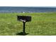 Community barbecue grill on the lawn with ocean view, perfect for outdoor dining at 809 Bahia Del Sol Dr # 72, Ruskin, FL 33570
