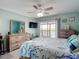 Bedroom featuring a ceiling fan, balcony, and large dresser at 809 Bahia Del Sol Dr # 72, Ruskin, FL 33570