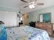 Serene bedroom featuring a queen bed, wooden dresser, and inviting decor at 809 Bahia Del Sol Dr # 72, Ruskin, FL 33570