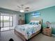 Bright bedroom featuring a ceiling fan and balcony access with stunning views at 809 Bahia Del Sol Dr # 72, Ruskin, FL 33570