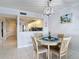 Dining area view showcases table, living room, and an opening to the kitchen space at 809 Bahia Del Sol Dr # 72, Ruskin, FL 33570