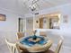 Dining area featuring a round table with four chairs, adjacent to kitchen and another room at 809 Bahia Del Sol Dr # 72, Ruskin, FL 33570