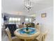 Dining room features a round table with living room in the background at 809 Bahia Del Sol Dr # 72, Ruskin, FL 33570