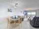 Bright dining area with a table, four chairs, and a view into the living room at 809 Bahia Del Sol Dr # 72, Ruskin, FL 33570