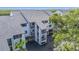 Exterior of condos featuring open-air staircases, blue shutters, and covered parking at 809 Bahia Del Sol Dr # 72, Ruskin, FL 33570
