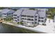 Waterfront condo with private balconies, manicured landscaping, and serene water views at 809 Bahia Del Sol Dr # 72, Ruskin, FL 33570