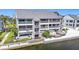 Waterfront condo featuring private balconies, lush landscaping, and convenient boat access at 809 Bahia Del Sol Dr # 72, Ruskin, FL 33570