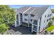 Exterior shot of condominiums with covered parking, private entrances, and multiple balconies at 809 Bahia Del Sol Dr # 72, Ruskin, FL 33570