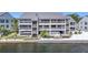 Waterfront condo with private balconies, staircase access, and well-maintained landscaping at 809 Bahia Del Sol Dr # 72, Ruskin, FL 33570