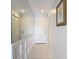 Hallway featuring tile floors and mirrored wall, with access to closets and rooms at 809 Bahia Del Sol Dr # 72, Ruskin, FL 33570