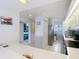 Kitchen area with a view through an opening to another room and a stainless steel fridge at 809 Bahia Del Sol Dr # 72, Ruskin, FL 33570