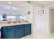 Kitchen with blue cabinets, white countertops, and an open view to the Gathering room and bedrooms at 809 Bahia Del Sol Dr # 72, Ruskin, FL 33570