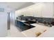 Kitchen area with stainless appliances, blue backsplash, and white countertops and cabinets at 809 Bahia Del Sol Dr # 72, Ruskin, FL 33570