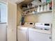 Laundry room featuring a side by side washer and dryer and shelving at 809 Bahia Del Sol Dr # 72, Ruskin, FL 33570