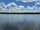 Scenic waterfront view featuring calm waters under a blue sky with scattered clouds at 809 Bahia Del Sol Dr # 72, Ruskin, FL 33570