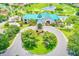 A beautiful aerial view of a community clubhouse and golf course at 9027 Merrimoor Blvd, Seminole, FL 33777