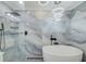 Bathroom with a free-standing white tub and luxury shower at 9027 Merrimoor Blvd, Seminole, FL 33777