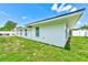 The home exterior shows a well-maintained lawn and white privacy fence at 9027 Merrimoor Blvd, Seminole, FL 33777