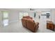 Spacious living area with tile floors and an open layout, perfect for modern living and entertaining at 9027 Merrimoor Blvd, Seminole, FL 33777