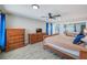 Bedroom suite with a walk-in closet and access to a private en-suite bathroom at 9027 Merrimoor Blvd, Seminole, FL 33777