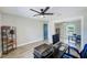 Office with a desk and computer and a bookcase at 9027 Merrimoor Blvd, Seminole, FL 33777